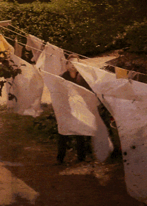 Michael Myers standing in the blowing sheets in John Carpenter's Halloween